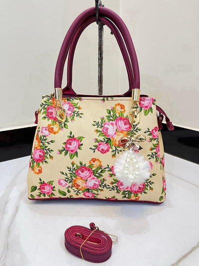 Elegant Floral Pattern Handbag with Stylish Handle and Charm Accent