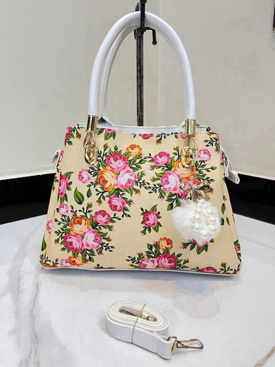 Elegant Floral Pattern Handbag with Stylish Handle and Charm Accent