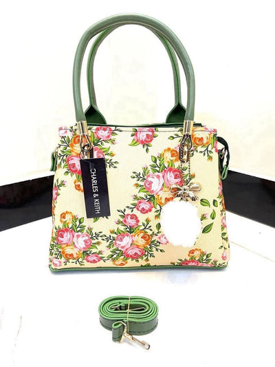 Elegant Floral Pattern Handbag with Stylish Handle and Charm Accent